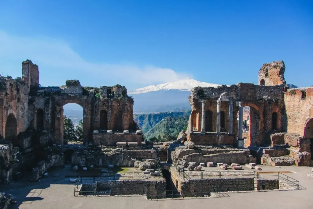 The ancient theatre of Taormina with Mount Etna in the background